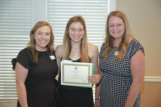 president and past president of OAPA with winner of a scholarship